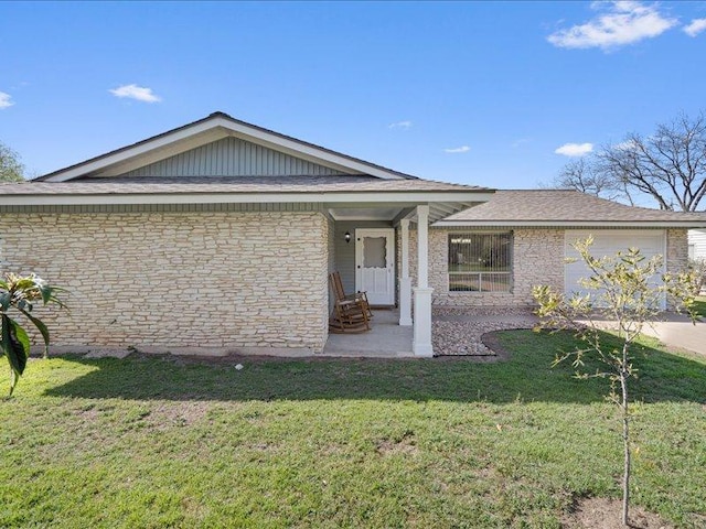 view of front of home with concrete driveway, a garage, and a front yard