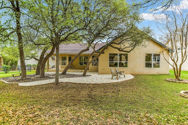 202 Whippoorwill Cv, Georgetown, TX 78633 - rear view of property featuring stucco siding and a patio area