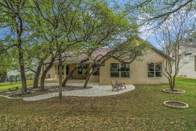 202 Whippoorwill Cv, Georgetown, TX 78633 - back of house featuring stucco siding and a patio