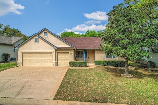 202 Whippoorwill Cv, Georgetown, TX 78633 - single story home with concrete driveway, a front yard, a garage, central AC, and stucco siding