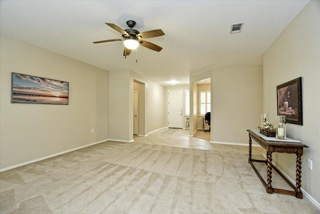 202 Whippoorwill Cv, Georgetown, TX 78633 - spare room with light carpet, ceiling fan, and baseboards