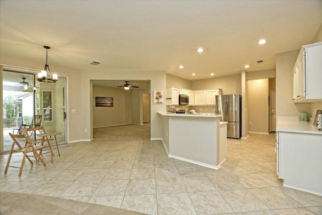 202 Whippoorwill Cv, Georgetown, TX 78633 - kitchen with stainless steel appliances, light countertops, light tile patterned floors, white cabinets, and recessed lighting