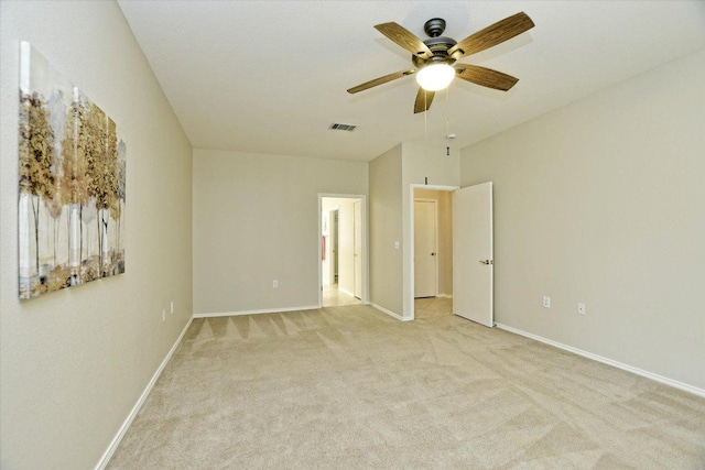 202 Whippoorwill Cv, Georgetown, TX 78633 - unfurnished bedroom featuring light carpet, baseboards, and a ceiling fan