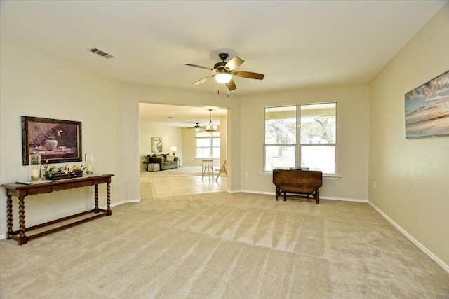 202 Whippoorwill Cv, Georgetown, TX 78633 - carpeted spare room with ceiling fan, baseboards, and a chandelier