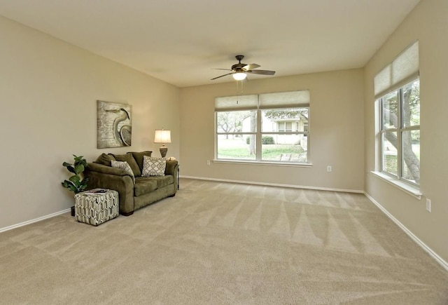 202 Whippoorwill Cv, Georgetown, TX 78633 - carpeted living room with a ceiling fan and baseboards
