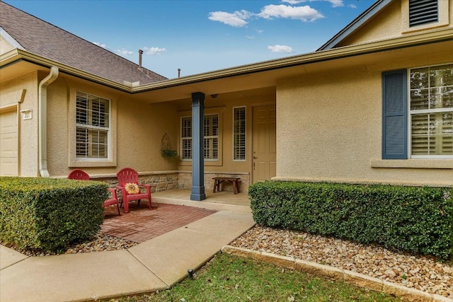 202 Whippoorwill Cv, Georgetown, TX 78633 - entrance to property with stucco siding, a garage, and a shingled roof