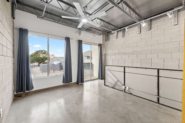 4801 S Congress Ave Unit H2, Austin, TX 78745 - spare room with concrete floors and concrete block wall