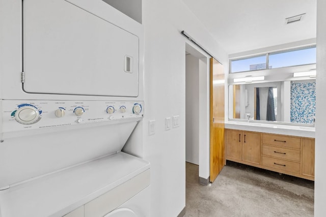 4801 S Congress Ave Unit H2, Austin, TX 78745 - washroom featuring stacked washing machine and dryer