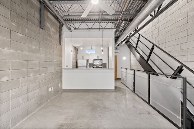 4801 S Congress Ave Unit H2, Austin, TX 78745 - interior space featuring freestanding refrigerator and ceiling fan