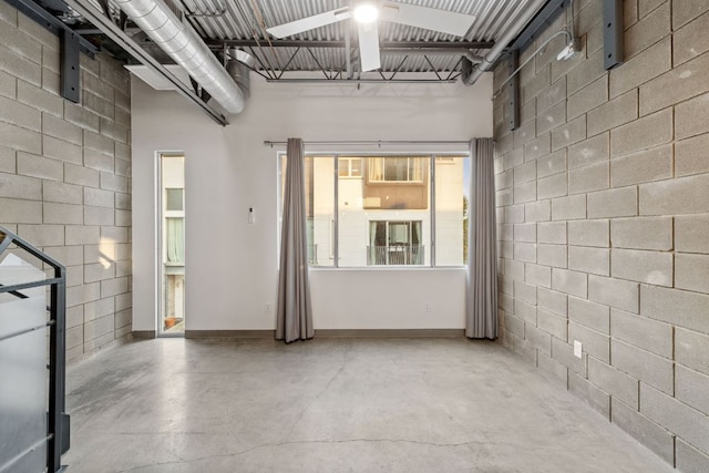4801 S Congress Ave Unit H2, Austin, TX 78745 - unfurnished room with a ceiling fan and concrete floors