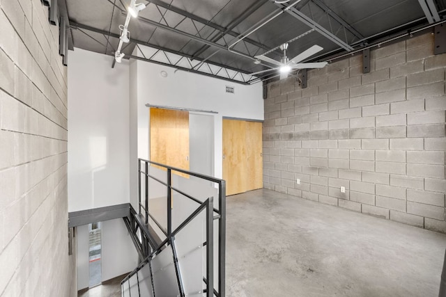4801 S Congress Ave Unit H2, Austin, TX 78745 - spare room featuring concrete block wall and concrete flooring