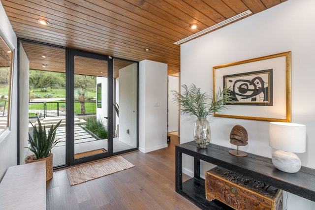 3931 R O Dr, Spicewood, TX 78669 - doorway featuring wood ceiling, dark wood-type flooring, baseboards, and recessed lighting