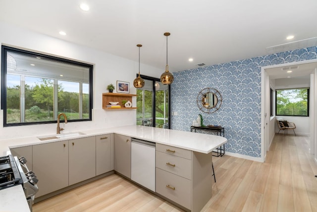 3931 R O Dr, Spicewood, TX 78669 - kitchen featuring a sink, dishwashing machine, wallpapered walls, gray cabinets, and stainless steel range