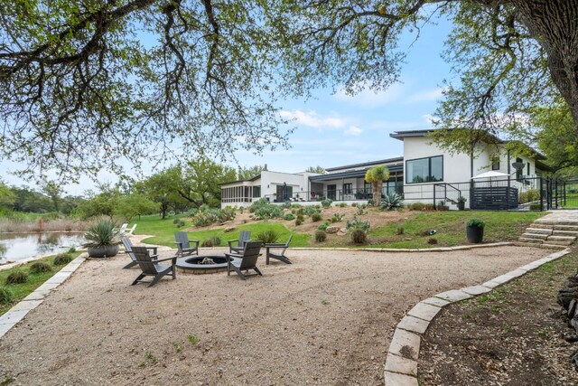 3931 R O Dr, Spicewood, TX 78669 - view of yard with a fire pit and a water view
