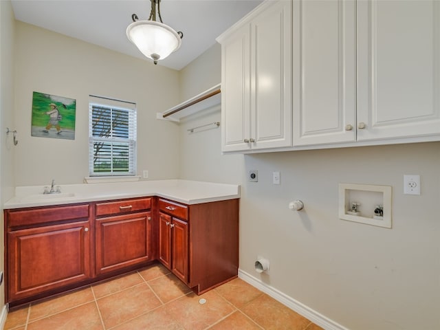 539 Colovista Pkwy Unit C103, Bastrop, TX 78602 - laundry room featuring hookup for an electric dryer, cabinet space, washer hookup, light tile patterned flooring, and baseboards