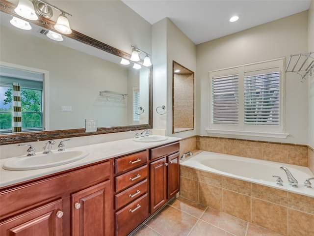 539 Colovista Pkwy Unit C103, Bastrop, TX 78602 - bathroom featuring tile patterned floors, a bath, and double vanity