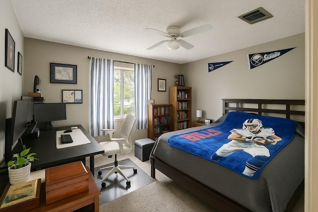 407 Trumpet Vine Trl, Cedar Park, TX 78613 - carpeted bedroom with an office area, a textured ceiling, and a ceiling fan
