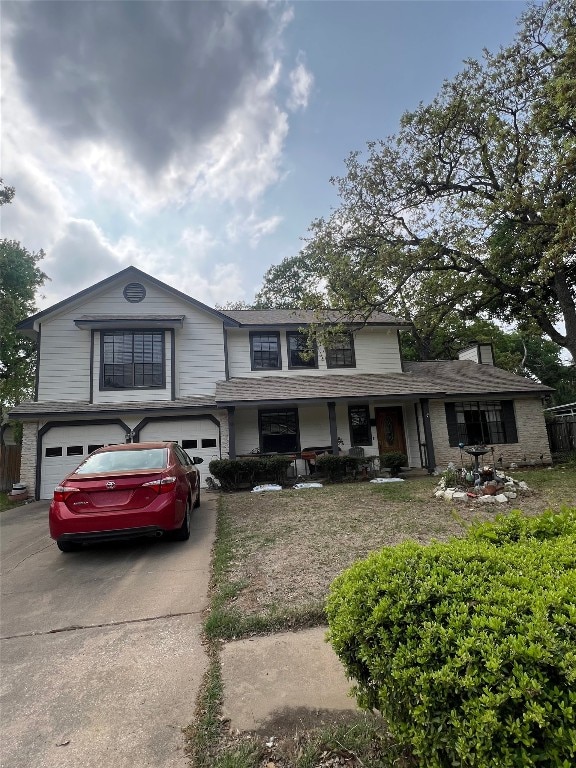 407 Trumpet Vine Trl, Cedar Park, TX 78613 - view of front facade with an attached garage, concrete driveway, a chimney, and brick siding