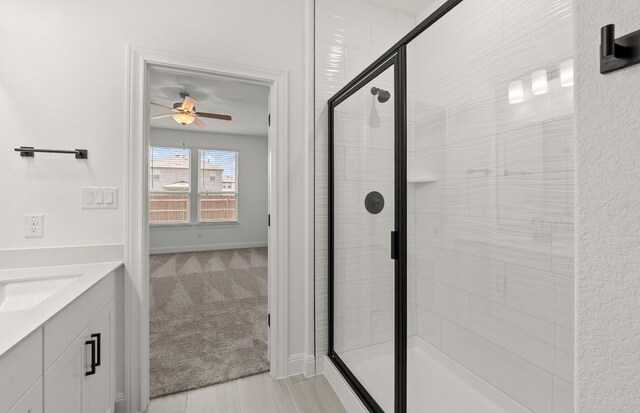 16824 Santiaguillo Trce, Manor, TX 78653 - full bathroom with a ceiling fan, a shower stall, and vanity