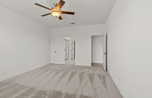 16824 Santiaguillo Trce, Manor, TX 78653 - unfurnished bedroom with light colored carpet and a ceiling fan