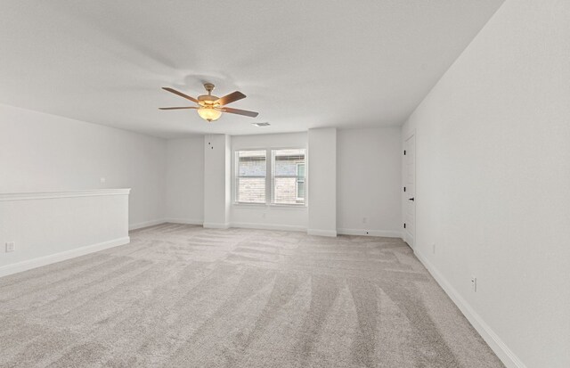 16824 Santiaguillo Trce, Manor, TX 78653 - empty room with a ceiling fan and light carpet