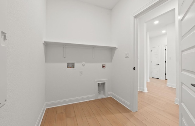 16824 Santiaguillo Trce, Manor, TX 78653 - washroom featuring gas dryer hookup, hookup for an electric dryer, washer hookup, light wood-style floors, and recessed lighting