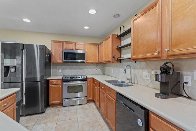 4932 Woodstock Dr, Georgetown, TX 78633 - kitchen with stainless steel appliances, a sink, open shelves, light countertops, and light tile patterned floors