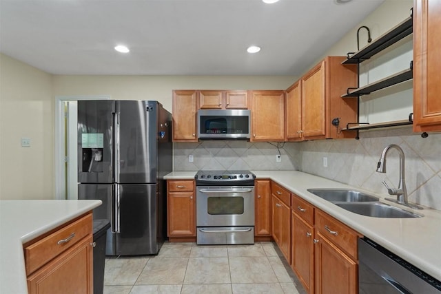 4932 Woodstock Dr, Georgetown, TX 78633 - kitchen with appliances with stainless steel finishes, a sink, open shelves, light countertops, and recessed lighting