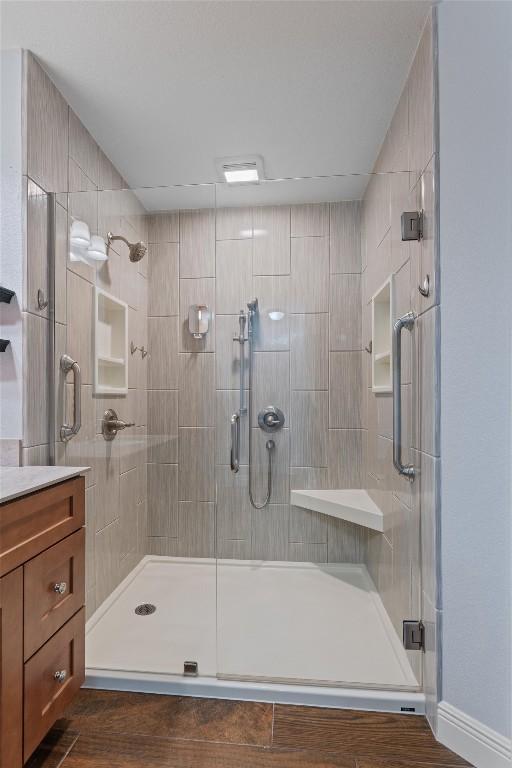 4932 Woodstock Dr, Georgetown, TX 78633 - bathroom featuring a shower stall and vanity