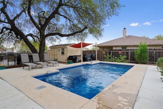 4932 Woodstock Dr, Georgetown, TX 78633 - view of pool with a fenced backyard, a patio, and an outbuilding