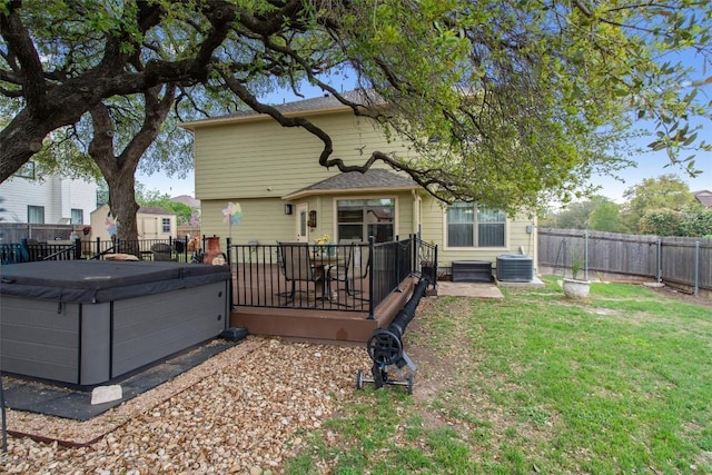4932 Woodstock Dr, Georgetown, TX 78633 - rear view of property featuring a hot tub, cooling unit, and a patio area