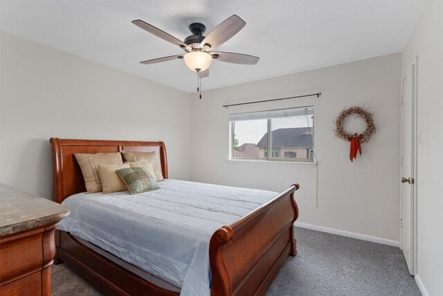 4932 Woodstock Dr, Georgetown, TX 78633 - carpeted bedroom featuring baseboards and ceiling fan