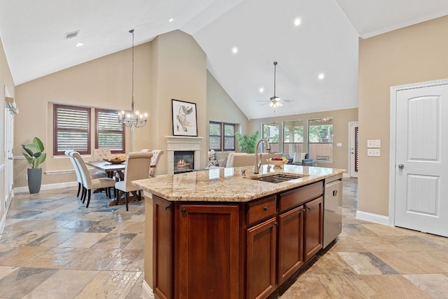 3985 Sapphire Loop, Round Rock, TX 78681 - kitchen featuring open floor plan, visible vents, a sink, and stone tile floors