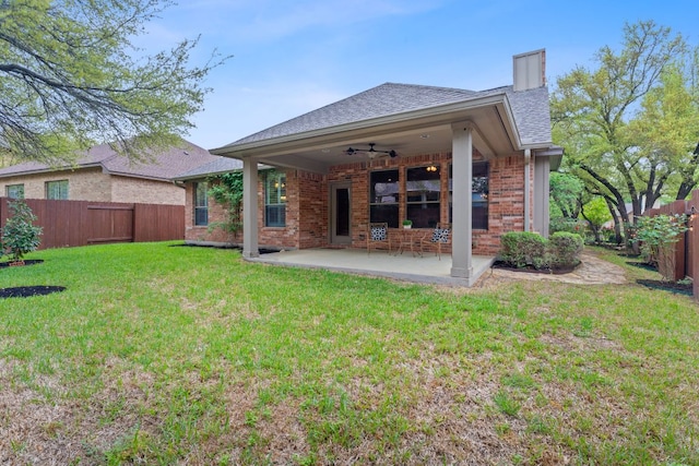3985 Sapphire Loop, Round Rock, TX 78681 - back of house with a fenced backyard, a ceiling fan, brick siding, a yard, and a patio area