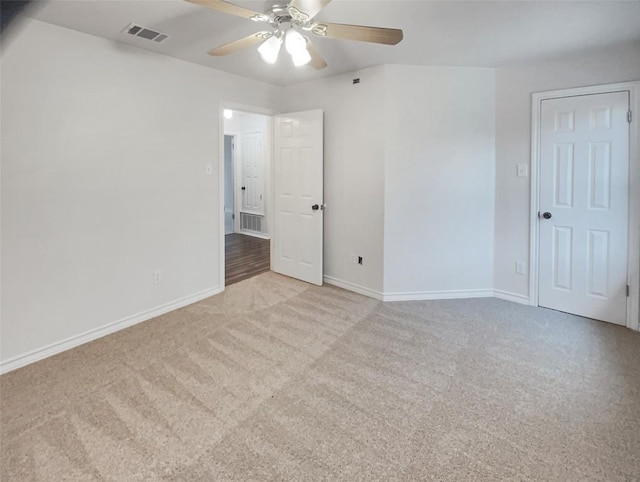 unfurnished room featuring visible vents, ceiling fan, baseboards, and carpet floors