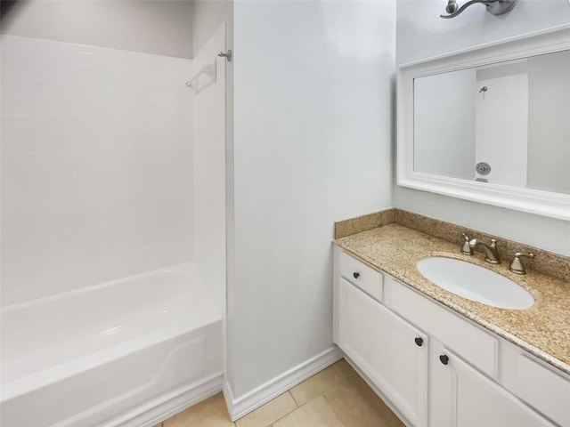 full bathroom with tile patterned flooring, vanity, baseboards, and tub / shower combination