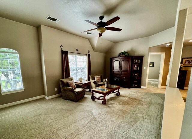 30105 Meadow Greens Dr, Georgetown, TX 78628 - living room with plenty of natural light, a ceiling fan, light colored carpet, and lofted ceiling