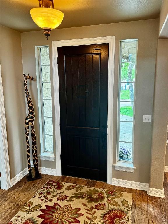 30105 Meadow Greens Dr, Georgetown, TX 78628 - entryway with wood finished floors