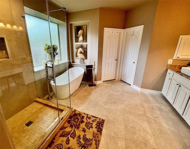 30105 Meadow Greens Dr, Georgetown, TX 78628 - bathroom with a shower stall, vanity, and a freestanding bath