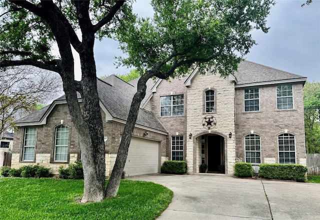 30105 Meadow Greens Dr, Georgetown, TX 78628 - french provincial home with concrete driveway, brick siding, and an attached garage