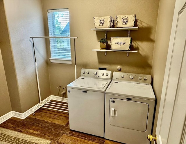 30105 Meadow Greens Dr, Georgetown, TX 78628 - washroom featuring washing machine and dryer, wood finished floors, and a textured wall