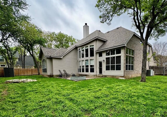 30105 Meadow Greens Dr, Georgetown, TX 78628 - back of property with a chimney, a patio, and a shingled roof
