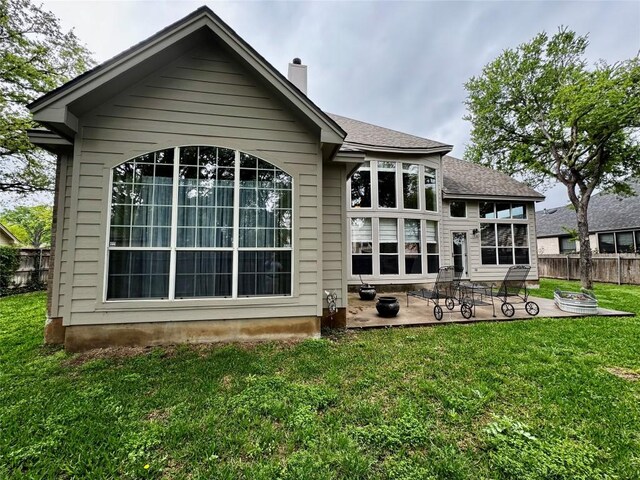 30105 Meadow Greens Dr, Georgetown, TX 78628 - back of property with a patio area and a chimney