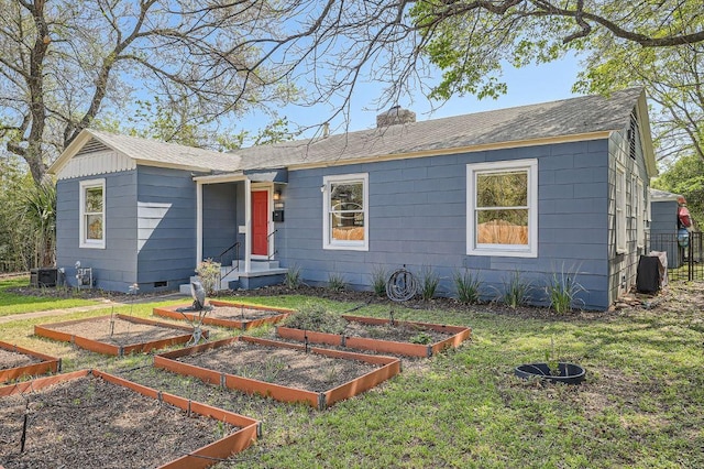811 E 45th St, Austin, TX 78751 - ranch-style house featuring a garden, a chimney, a shingled roof, and crawl space