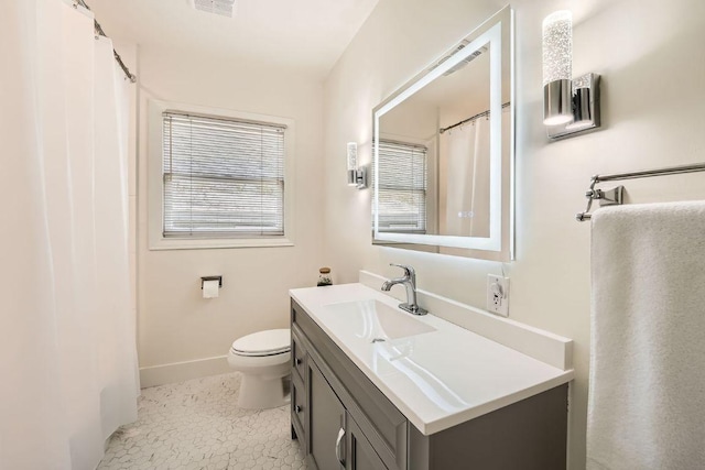 811 E 45th St, Austin, TX 78751 - bathroom with vanity, toilet, and baseboards