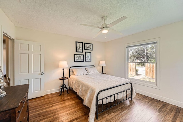 811 E 45th St, Austin, TX 78751 - bedroom with a textured ceiling, hardwood / wood-style floors, and a ceiling fan