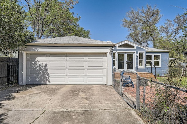 811 E 45th St, Austin, TX 78751 - ranch-style home with a fenced front yard, driveway, and an attached garage