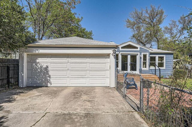 811 E 45th St, Austin, TX 78751 - ranch-style house featuring a fenced front yard, driveway, and an attached garage