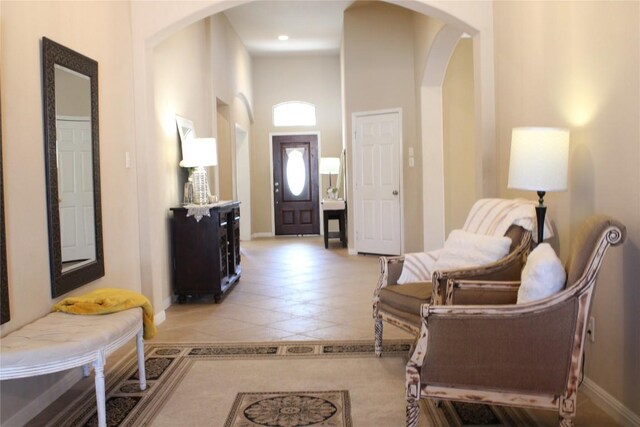 2718 Sun Mountain Dr, Leander, TX 78641 - foyer featuring arched walkways and light tile patterned flooring