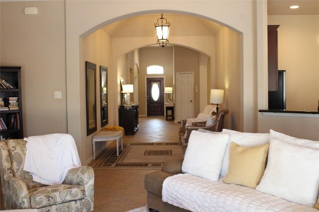 2718 Sun Mountain Dr, Leander, TX 78641 - living room with arched walkways and tile patterned flooring
